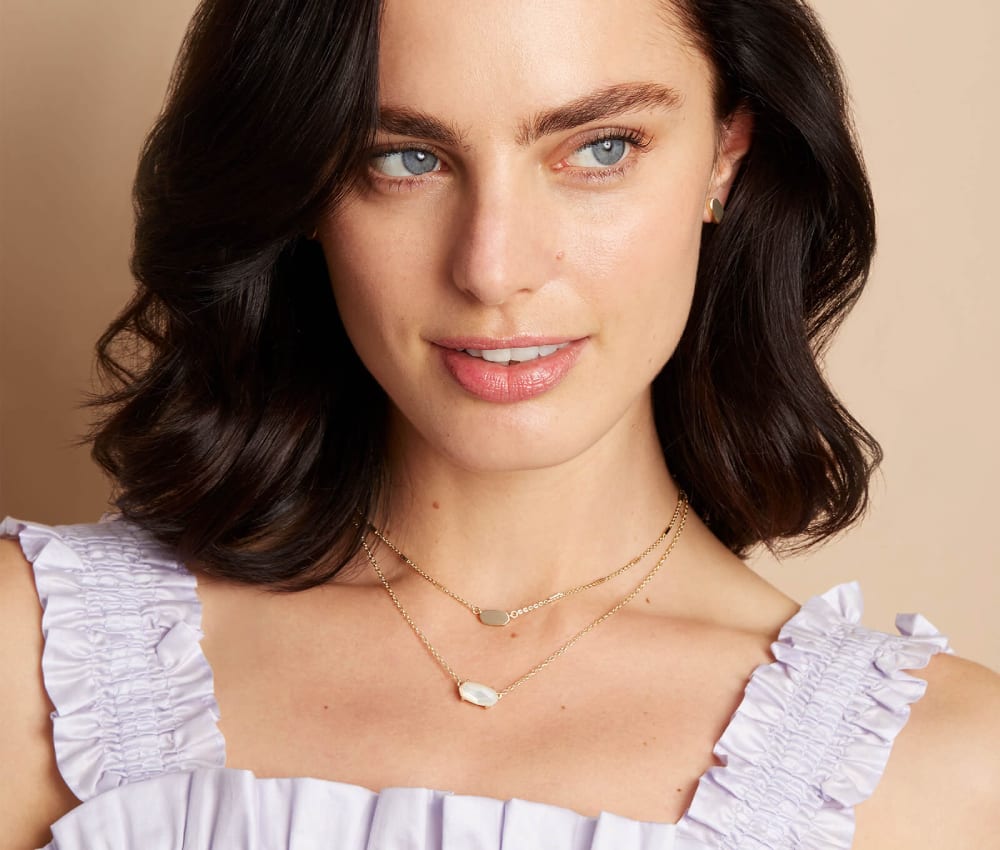 Minimalist jewelry: 12 hand picked pieces all affordable and delicate 15 kendra scott ever necklace gold ivory mother of pearl 03 lg 1